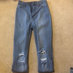 High waisted skinny jeans with rips in knee